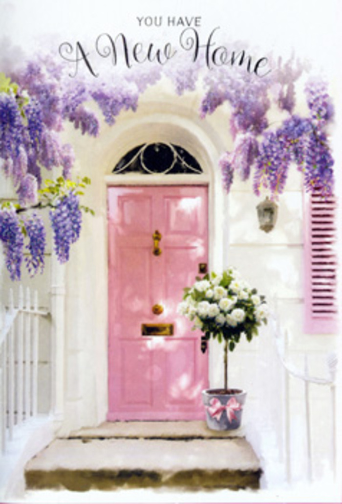 In this scene, a serene Cubitt Town doorway becomes a delicate stage for flowers to tell a story of moving in, unpacking memories, and starting afresh. At the centre is a painted pink front door, its hue soft and powdery, reminiscent of the gentle tones you might see reflected at sunset on the Thames. The finish is matte, absorbing the daylight so that the colour feels warm and embracing rather than bright. Framing the doorway, wisteria cascades from above in generous swags, the flower clusters composed of tiny petals in varying shades of lavender, lilac, and soft violet. The blooms hang down like suspended garlands, adding a sense of depth and texture as they overlap in front of the whitewashed wall. A simple shutter, brushed in a harmonising pastel tone, completes the scene and helps guide the eye back to the doorway. On the step, a grey metal bucket serves as a rustic, contemporary container for an abundant bouquet of white roses. The roses are lush and layered, their petals creamy and dense, with a few blooms leaning slightly outwards as if reaching toward whoever approaches. Between them, fresh green foliage adds subtle contrast and keeps the arrangement looking natural and just-arranged, as if it has been prepared moments ago by a nearby Cubitt Town florist. A soft pink satin ribbon encircles the bucket, its ends trailing in loose, graceful lines that echo the curves of the wisteria vines overhead. The whole scene feels gentle and hopeful, the kind of floral welcome that calms the nerves of moving day and fills a new riverside home with beauty, comfort, and quiet joy.